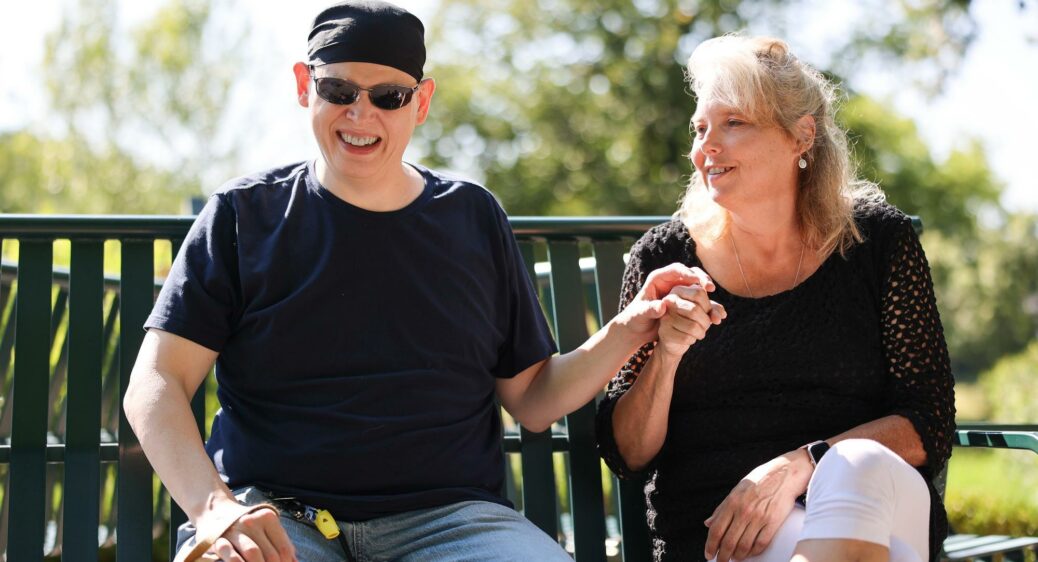Jason Judy using sign language with his independent DSP Clairanne Uebelacker.